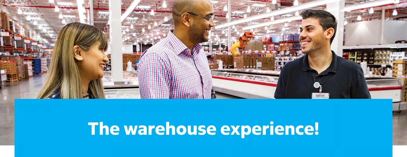 The Costco Westgate warehouse interior — racking to the ceiling, members chatting with staff